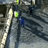 A building floor collapses as a construction crew lays concrete