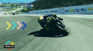 A motorcycle racer narrowly misses other crashed racers