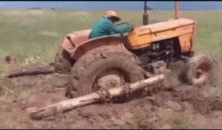 A tractor flips upside down trying to get unstuck